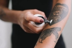 erasing your tattoo, erasing tattoo, 7 frequently asked questions about erasing your tattoo answered, It hurts