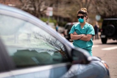 Medics in scrubs stand up against protestors in US