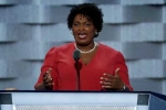 Stacey Abrams, flag, stacey abrams helped torch state flag during college protest, Abram