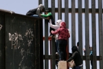 punjabis Crossing Border Fence, entering US via mexico, video clip shows punjabi women children crossing border fence into u s, Punjabis